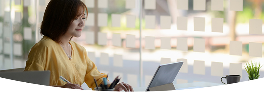 Young women in an office working on a laptop