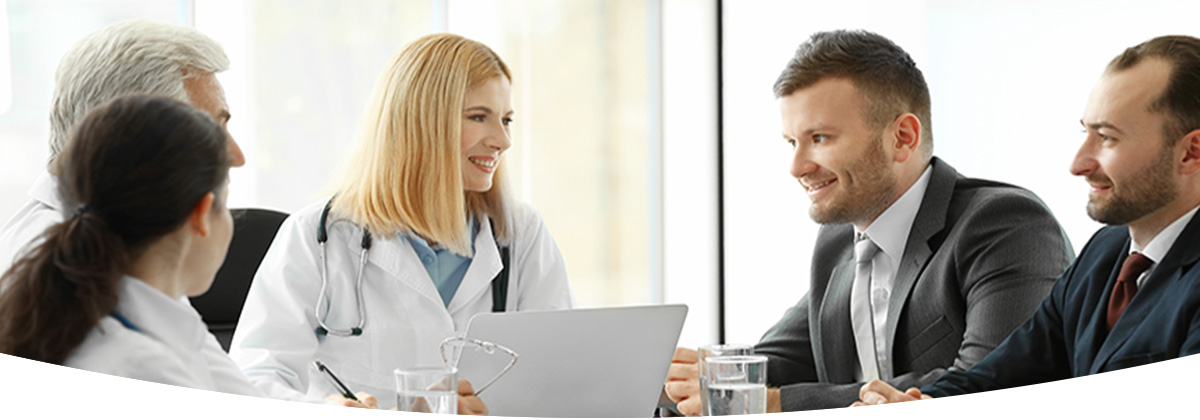 Healthcare professionals in a boardroom discussing Risk Management