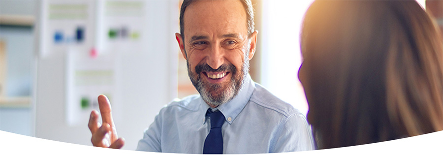 Older man smiling at a woman