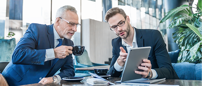 Men looking at a tablet