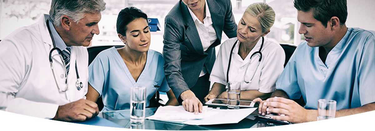 doctors looking at paper on table