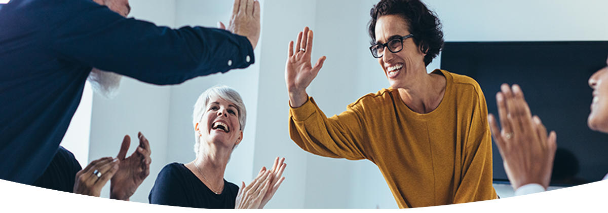 woman in yellow giving high-five